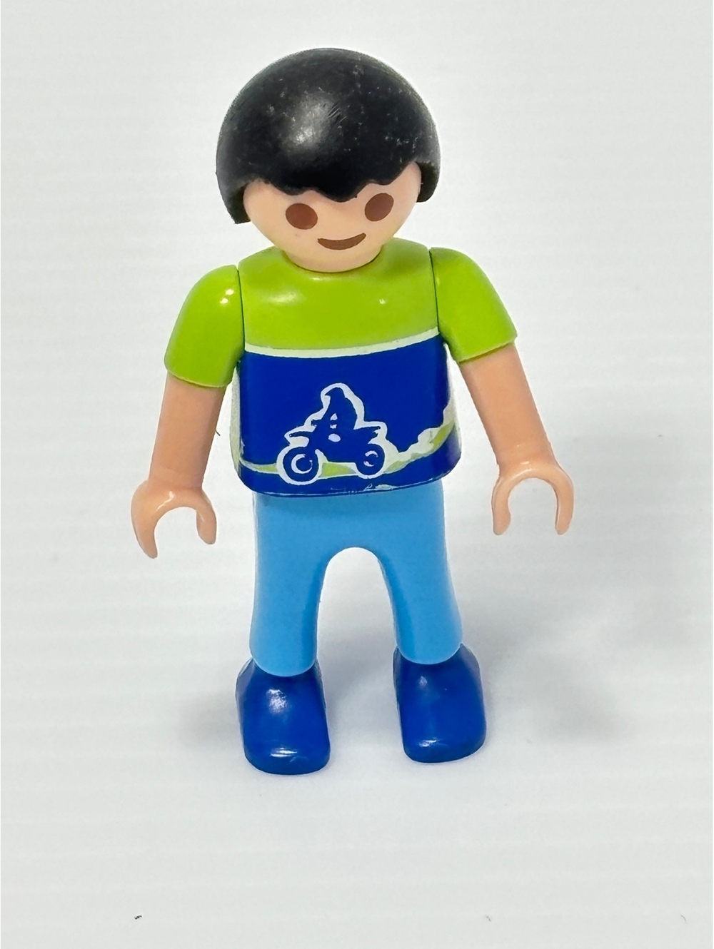Playmobil Figure with Black Hair, Green and Blue Outfit, Motorcycle Logo
